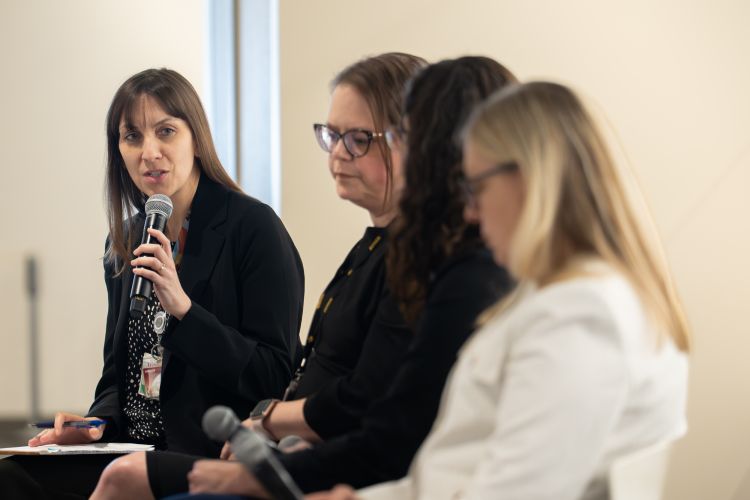 Panelists talking at Research Day.