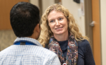 Dr. Kelly Lavin talks to a primary care resident