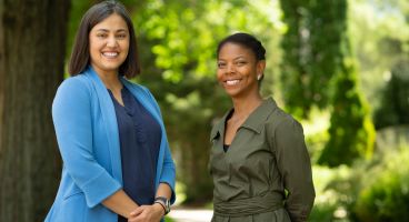 Dr. Pophali, on left, with Cibele Barbosa Carroll, MD, PhD, MPH, a scientist in the cancer survivorship research program.