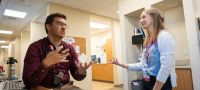 Dr. Michael Houghan talks with a resident.