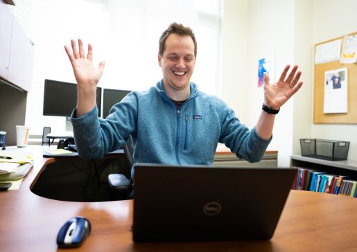 Internal medicine residency program director Dr. Andy Coyle reacts to match results on the computer on his desk