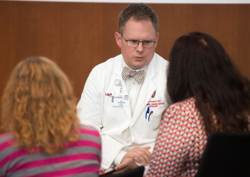 Toby Campbell, MD, discusses care with patients.