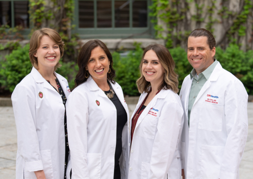 The 2022-23 chief residents, in a group outside and wearing their white coats.