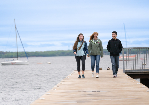 Graduating 2023 internal medicine residents Amy Bier, MD, Ivana Surjancev, MD, and Ran Tao, MD, enjoy a quiet moment by Lake Mendota. Credit: Clint Thayer/Department of Medicine.