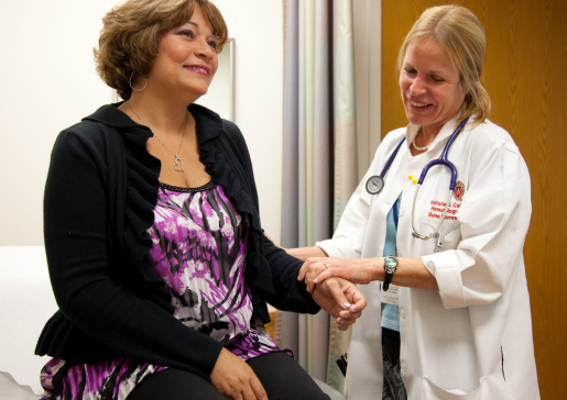 Dr. Natalie Callander with a patient in the clinic