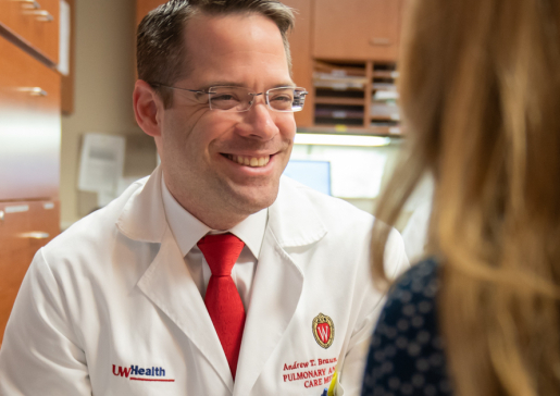 Dr. Andrew Braun talks in the office