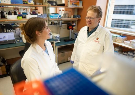 Research assistant and lead author, Michaela Trautman, in the lab with senior author Dudley Lamming, PhD. Credit: Clint Thayer/Department of Medicine.