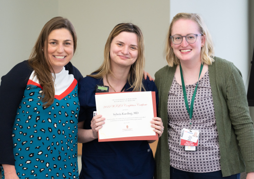 Dr. Sylwia Kaeding holds WILD program completion certificate, Dr. Sarah Donohue and Dr. Dana Ley stand on either side of her.