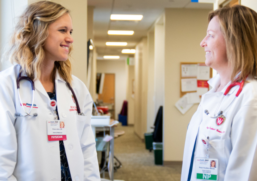 Dr. Briana Jelenc and a nurse practitioner talk in the clinic hall