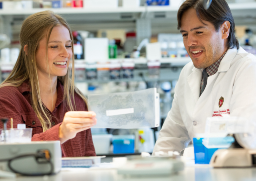 Dr. Francisco Alvarado and member of lab team at the lab bench