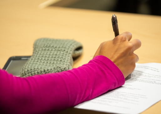 closeup of woman's hand writing