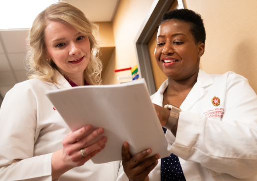 Elizabeth Holden, NP, and Lisa Jones, MD, MPH, look at a chart in the Gastroenterology Clinic