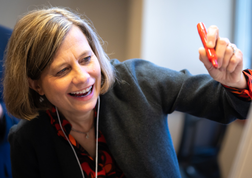 Closeup of Associate Vice Chair for Education Laura Zakowski, MD, writing on a flipchart