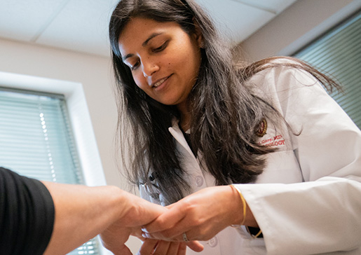 Dr. Shivani Garg examining a patient in the clinic