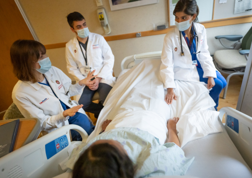 Dr. Farah Kaiksow teaches learners in an inpatient room