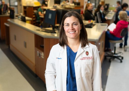 Faculty member Dr. Jacqueline Kruser standing at the ICU nursing station