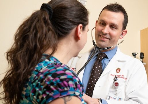 Dr. John Hayner examines a patient in the Internal Medicine clinic