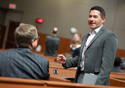 Dr. David Schneider talks with a participant at the WisconsINFORMATICS conference