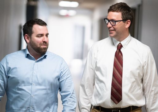 Dr. Vasilevskis walking in a hallway with a colleague