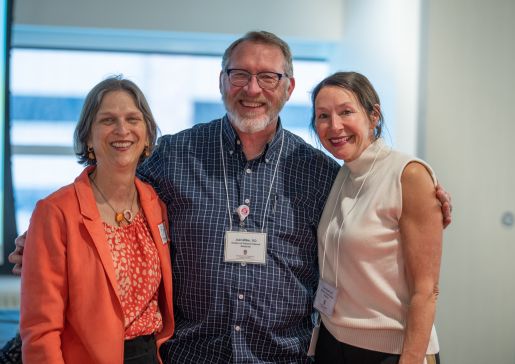 Photo of Dr. Joel Miller, in center, with his General Internal Medicine colleagues Betsy Trowbridge, MD, Kenneth D. Skaar, MD, Chair of Primary Care and division chief, on left, and Lisa Grant, DO, MSW, clinical professor, on right.