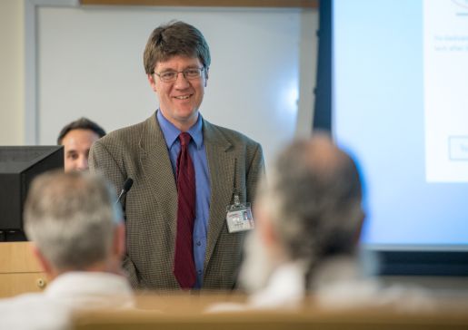 Ryan Mattison standing at the front of a room, giving a presentation