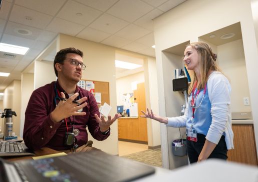 Dr. Michael Houghan talks with a resident.