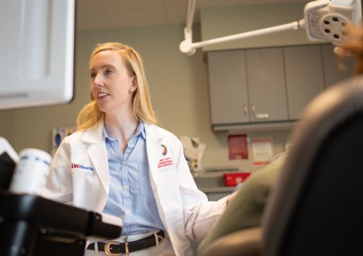 Megan Lutz performs an intestinal ultrasound on a patient.
