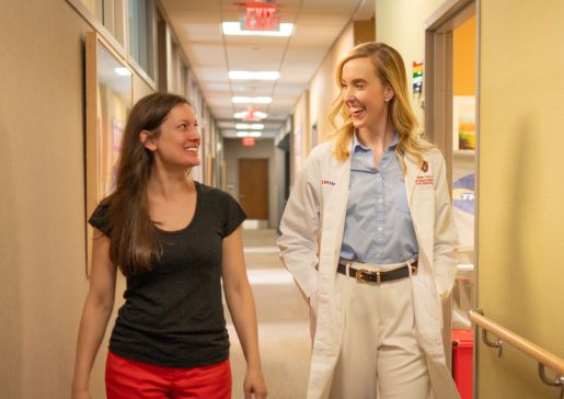 Dr. Megan Lutz and Monica Zablotney walking in a clinic hallway