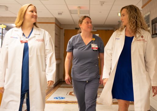 The Lung Transplant team walking and talking in a hallway.