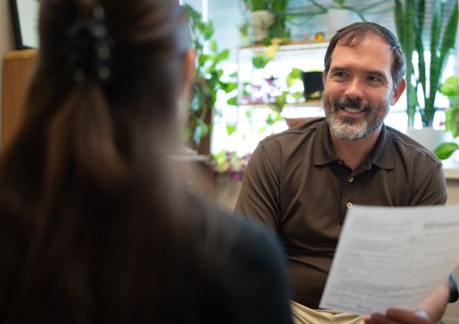 David Castellanos, PA, physician assistant-primary care, General Internal Medicine, consulting with a colleague on a recent ADHD evaluation. 