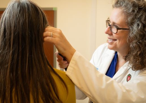 Dr. Joan Neuner examining a patient.