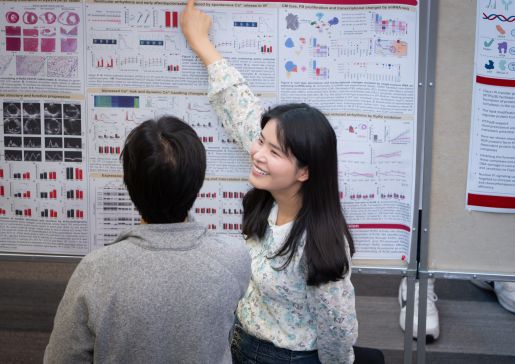 Researcher presenting at a poster session