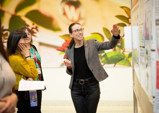 Abby Mapes pointing something out at Education Day.